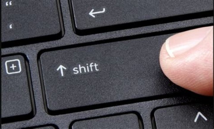Shift button on Keyboard.